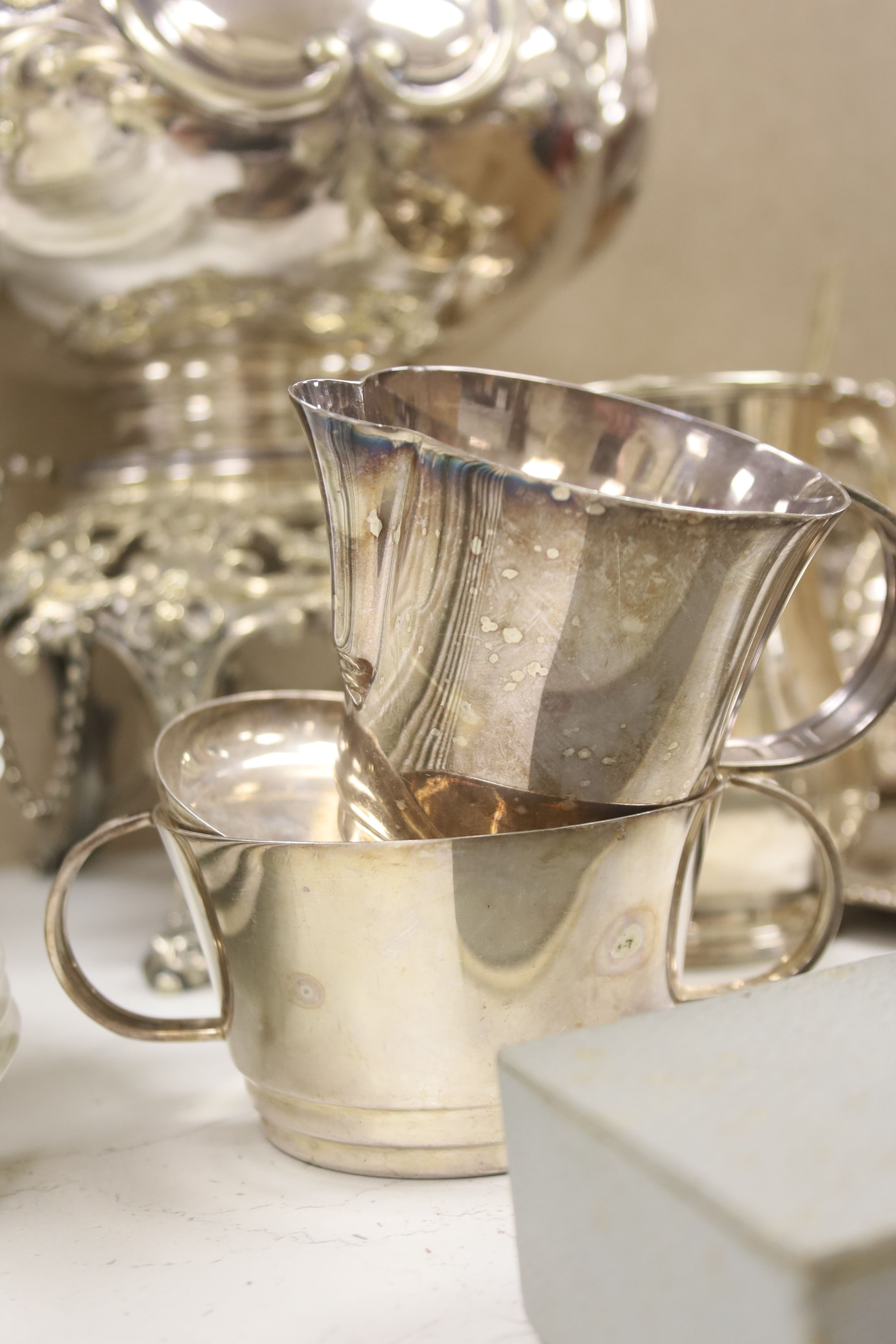 A silver plated tea kettle on stand with burner, 54cm high, and a small quantity of other plated items.